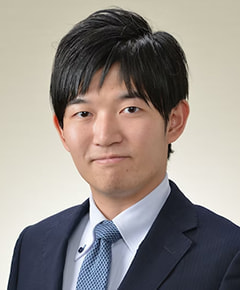 都築　伸弥 氏